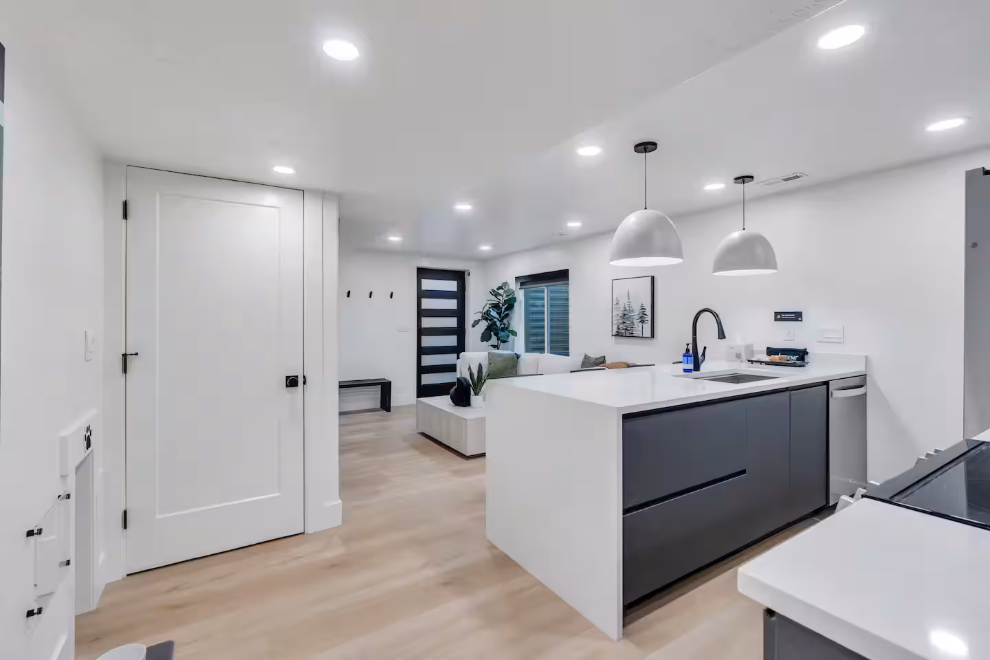 Fully equipped modern kitchen with Quartz waterfall countertops