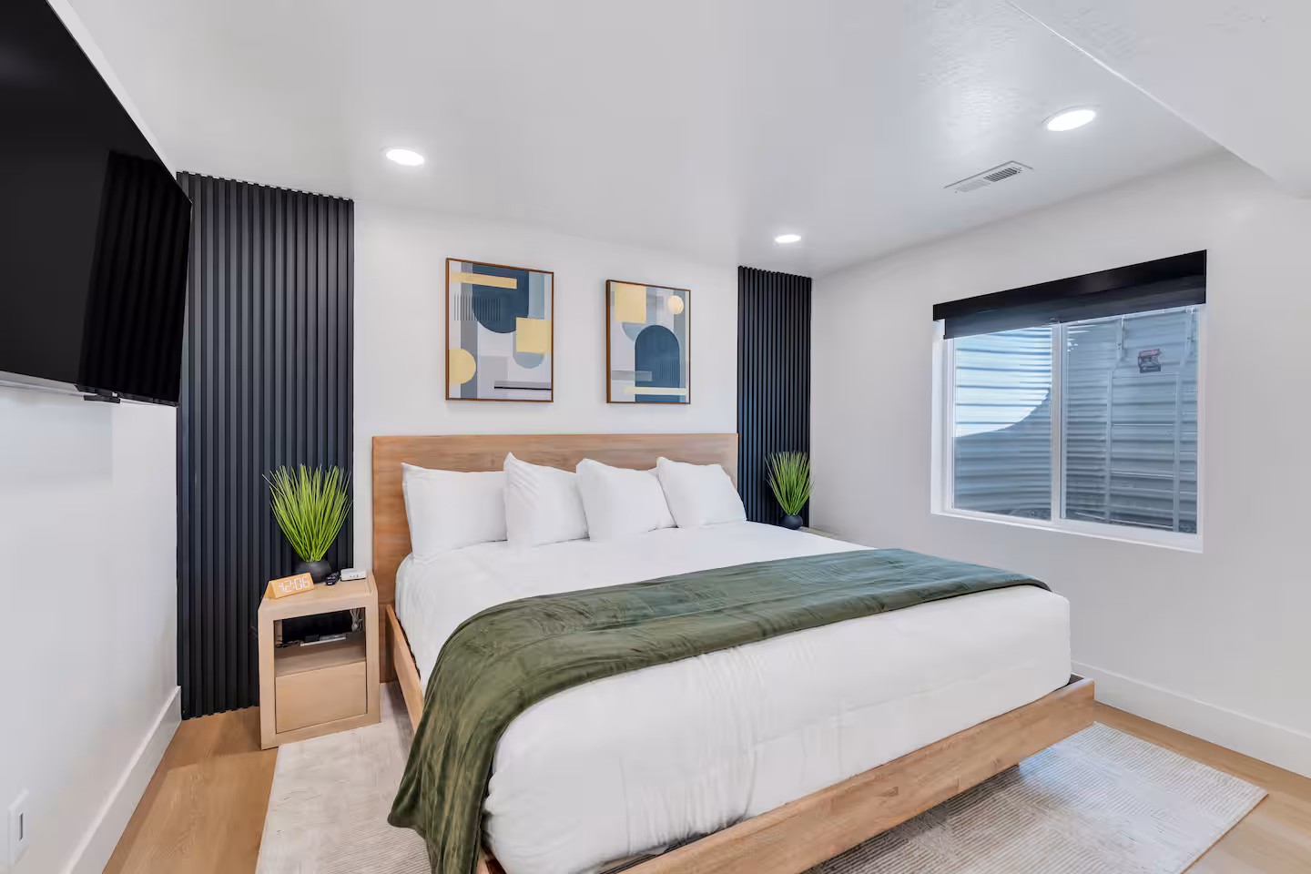 Master bedroom with king-size bed in a modern decorated room